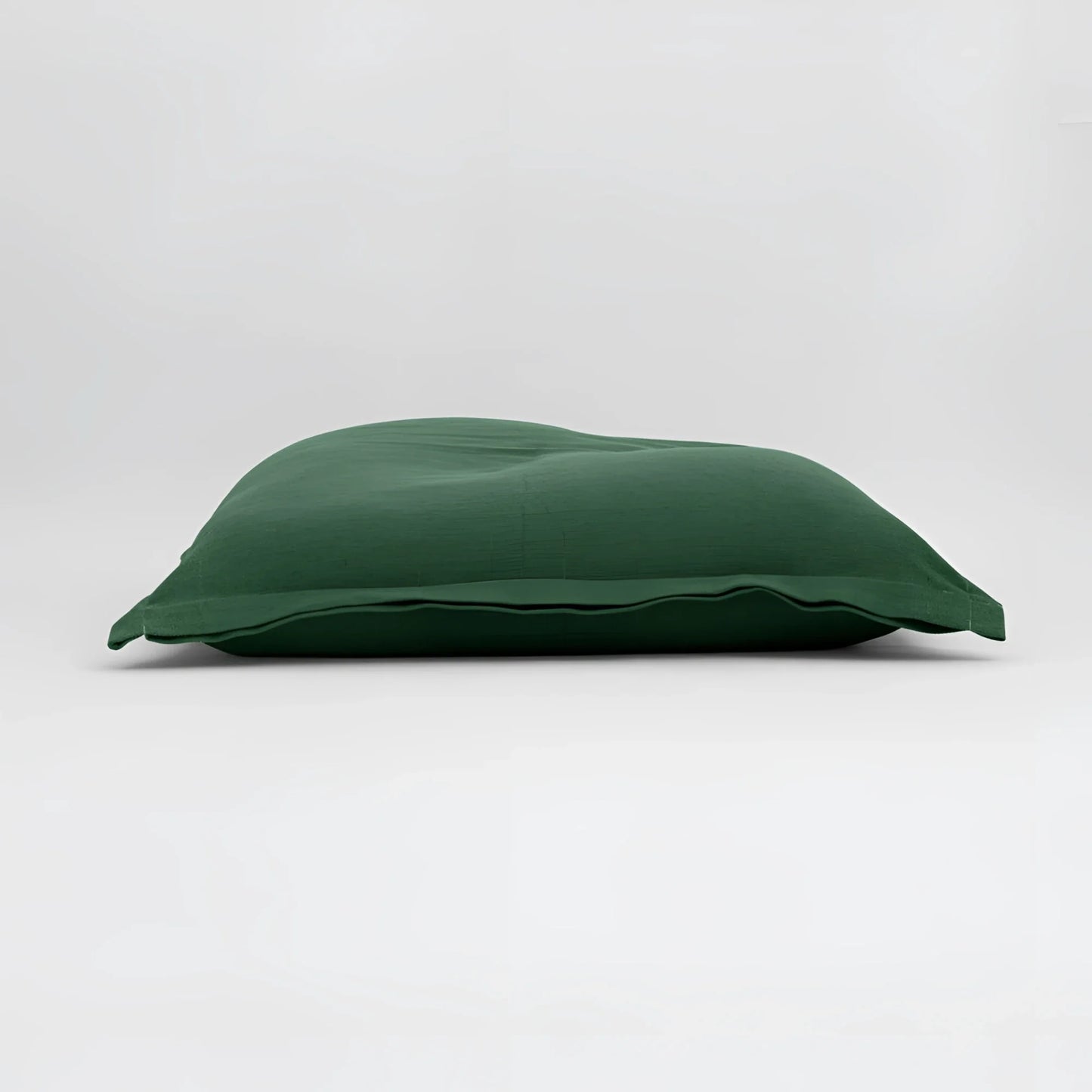 Maxi cuscino firenze verde scuro con superficie morbida leggermente arricciata dimensioni generose infinito abbraccio