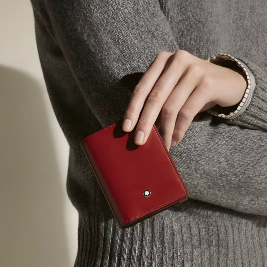 Portacarte meisterstück in pelle rossa ruggine scuro con logo montblanc centrale e finitura lucida