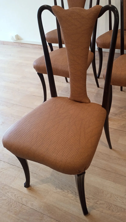 Eleganti sedie pranzo vintage con gambe scure curve e seduta e schienale imbottiti marroni design mid century anni 50